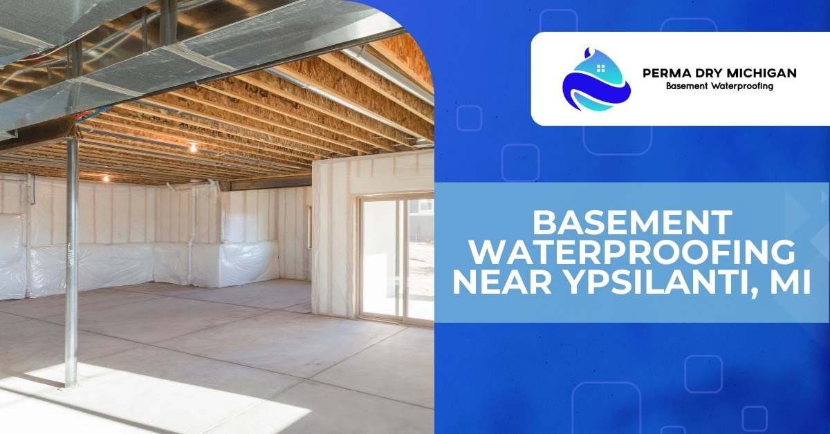 A promotional graphic for Perma Dry Michigan Basement Waterproofing, featuring an unfinished basement with concrete floors, exposed wooden joists, and white insulated walls on the left, and a blue graphic on the right with the company logo, "Perma Dry Michigan Basement Waterproofing," and the headline "Basement Waterproofing Near Ypsilanti, MI" in bold white text.